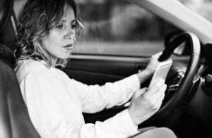 Positive Trends in Mobile  Phone Use, Woman using mobile phone while driving