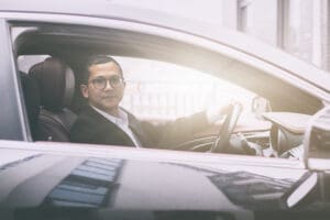 Man looking out of window, cheap car inurance in ireland, insurance for car in ireland