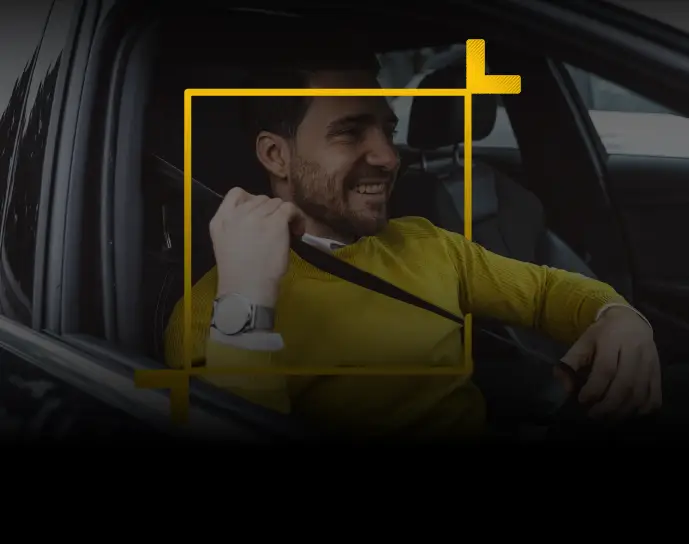 Man fixing seatbelt in a car